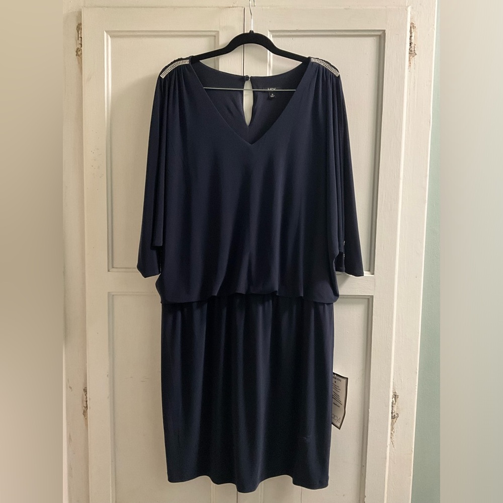 Navy blue short formal dress with rhinestone accents on the shoulder